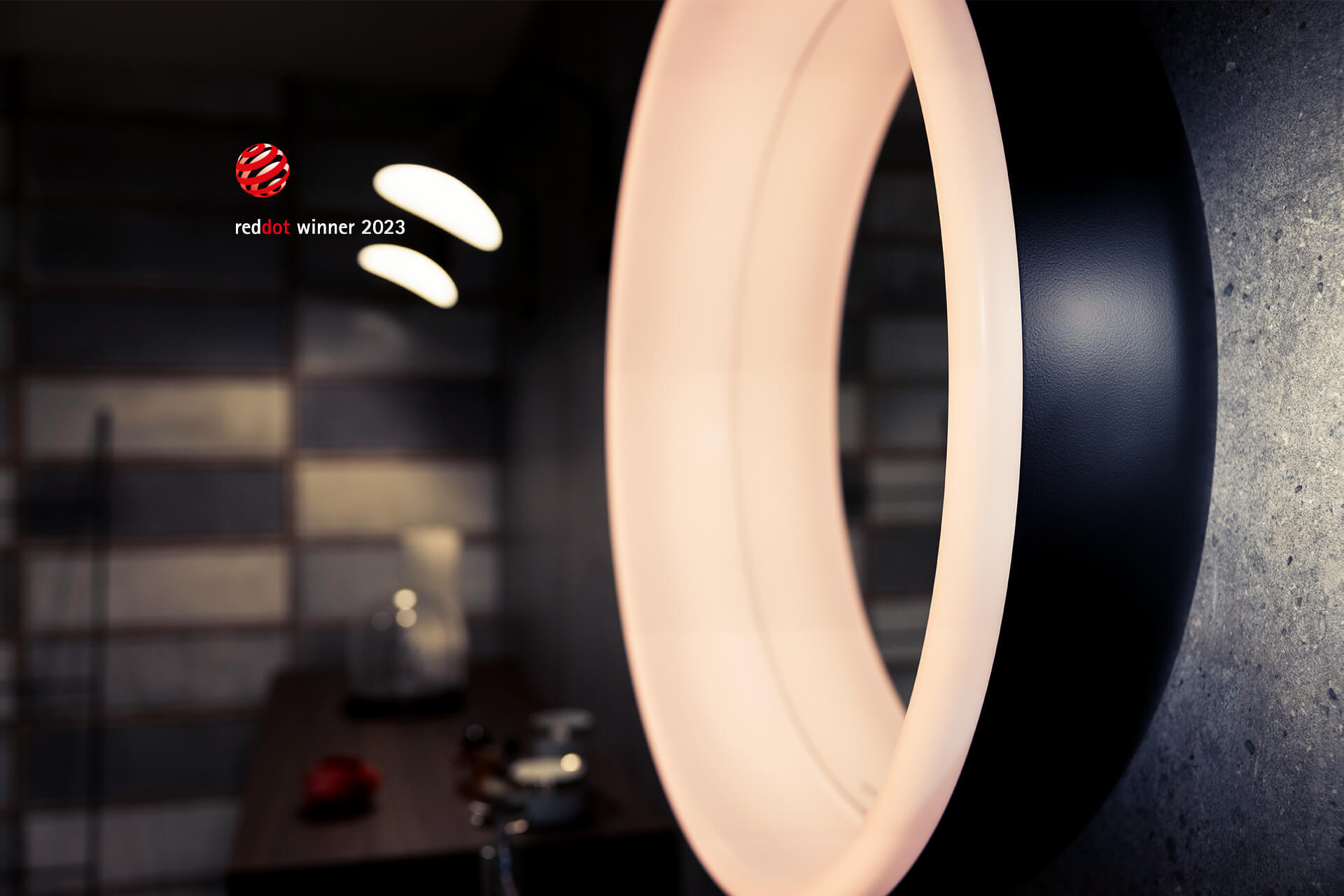 LUNE SP D2W illuminated mirror Light mirror on concrete wall. Close-up with lamps and ceramic plates in the background.